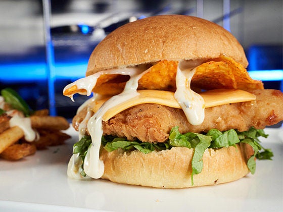 Image of crispy sandwich with nacho chips within the sandwich.