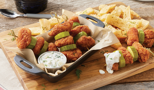 Spicy Chicken ’n’ Pickle Bites with a side of French fries and sauce