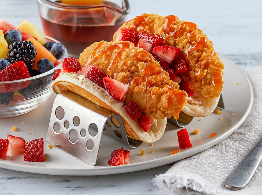Chicken and Pancake Breakfast Tacos with a side of fruit on plate