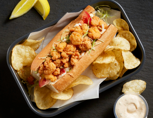 Tyson® Mini Chicken Bites served on a fresh chicken Po’ Boy Sandwich