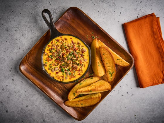 Cheeseburger Quest In a Skillet on a Board
