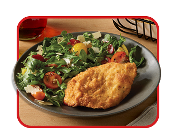 plated chicken filet and side salad