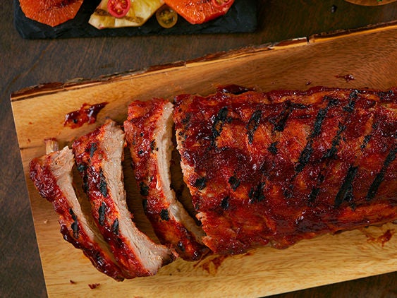 Image of baby back ribs on a cutting board.