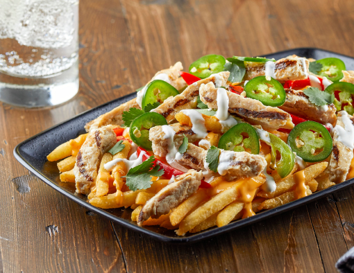 Chicken Fajita Loaded Fries featuring Tyson Red Label® Fajita Seasoned Chicken Breast Strips