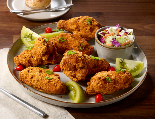 Pimento Cheese Rubbed Wings on a grey plate with a side of slaw
