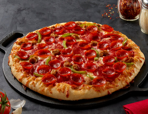 meaty trio pizza on a skillet tray