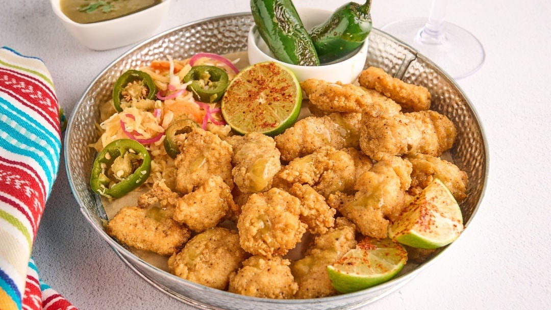Crispy hot honey boneless wings with a smoky charred jalapeño lime butter