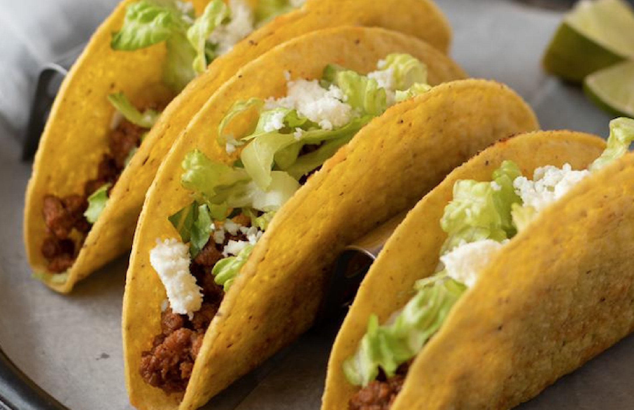 Three yellow corn taco shells