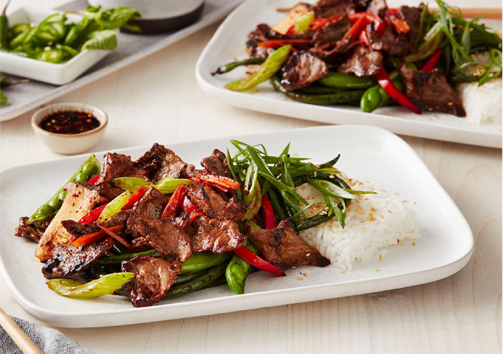 Stir-fry beef with green beans, red bell peppers, spring onions, served with steamed rice