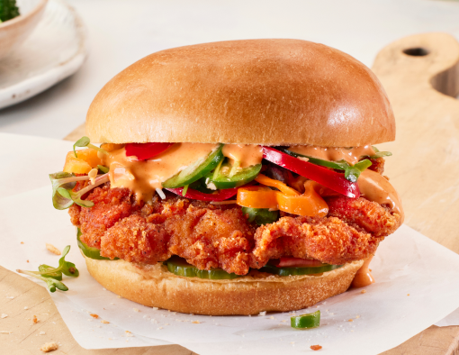 Spicy Korean Style Breaded Chicken Sandwich on parchment paper