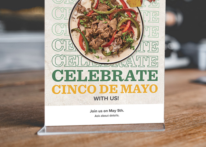 Cinco de Mayo promotional counter card in acrylic holder on a counter