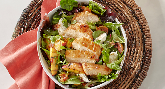 grilled peach burrata salad with large chunks of juicy chicken breast and seasonal grilled pears