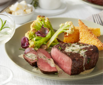 Plated beef steak with broccoli and corn bread