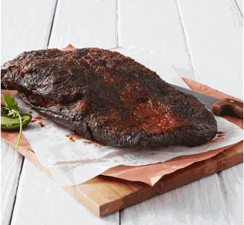 Whole smoked brisket with a dark, seasoned bark resting on a wooden cutting board.