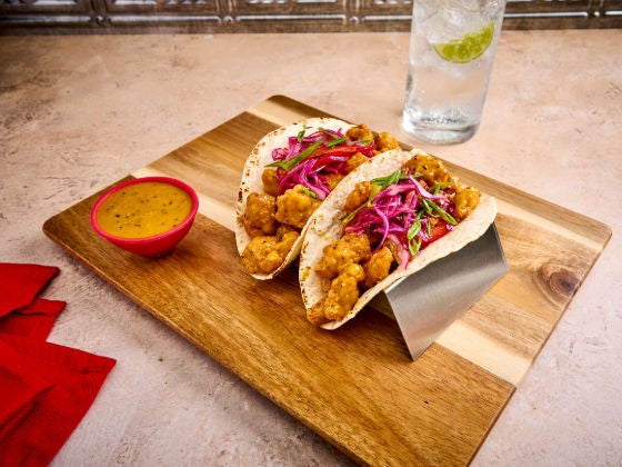 Carolina Gold BBQ Chicken Tacos on a cutting board.