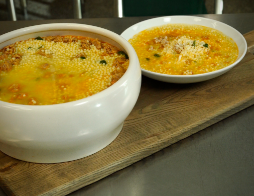 wedding soup with Italian Sausage, fresh spinach, pearl pasta and a rich roasted chicken stock
