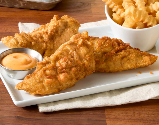 Three breaded fried chicken tenderloins served with dipping sauce, served with crinkle-cut fries