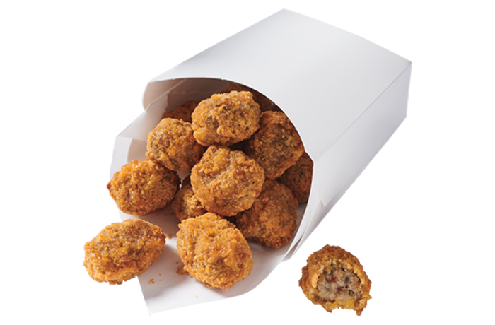 A cardboard serving container with breaded sausage bites