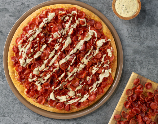 Pepperoni Profusion Pizza featuring Hillshire Farm® Cupping Pepperoni on prep surface