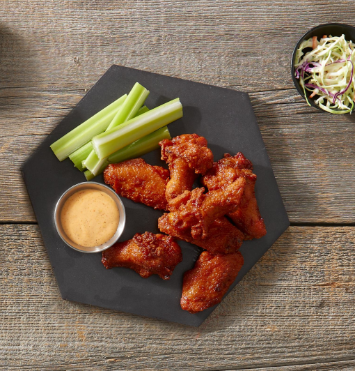 Tyson bone-in wings with a side of sauce and celery