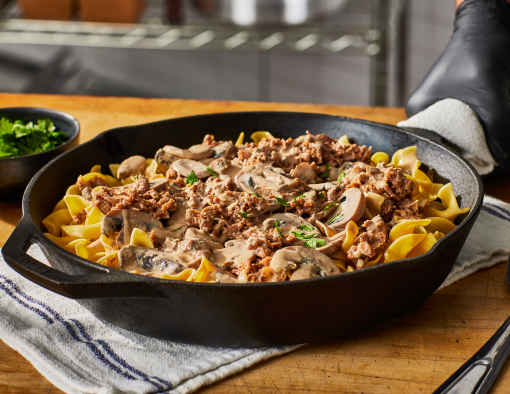 Beef Stroganoff is sautéed with garlic, onion, tomato paste and flour