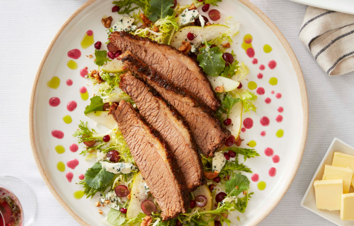 Sliced brisket served over mixed greens with pears, grapes, pomegranate seeds, walnuts and blue cheese.