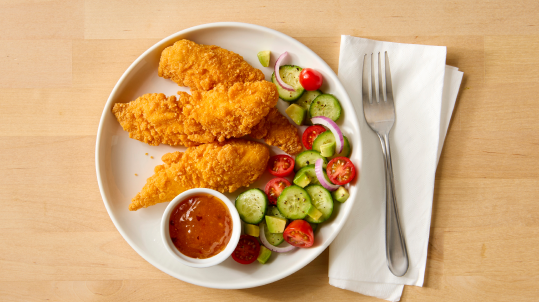 Gluten free chicken strips with a side of sauce