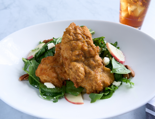 Honey Chicken and Apple Salad bed of crisp arugula and spinach with toasted pecans, sliced honey crisp apples and feta cheese