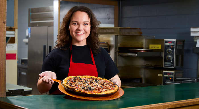 2024 grand prize winner holding a pizza